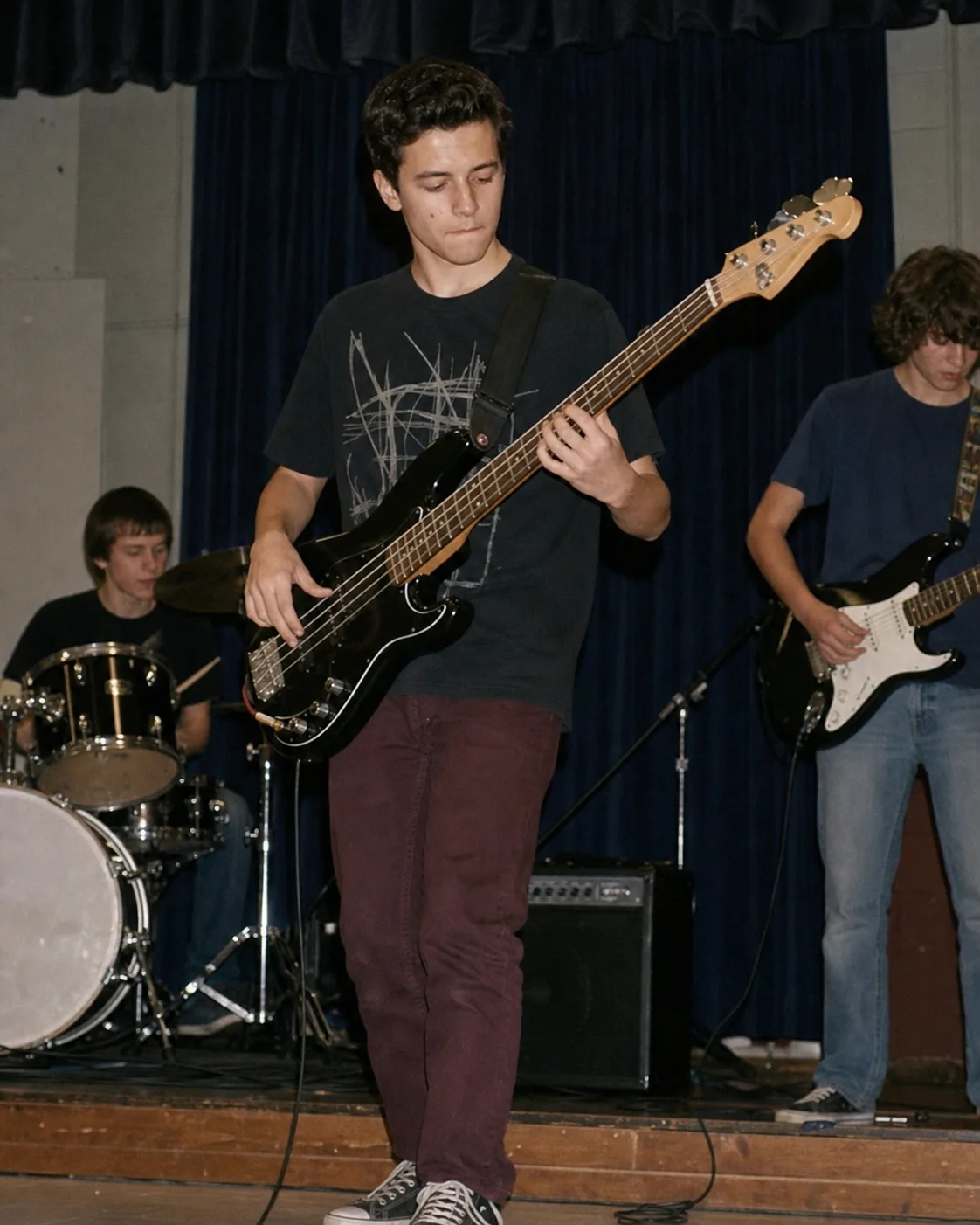 Teenage Alex playing bass with a school band