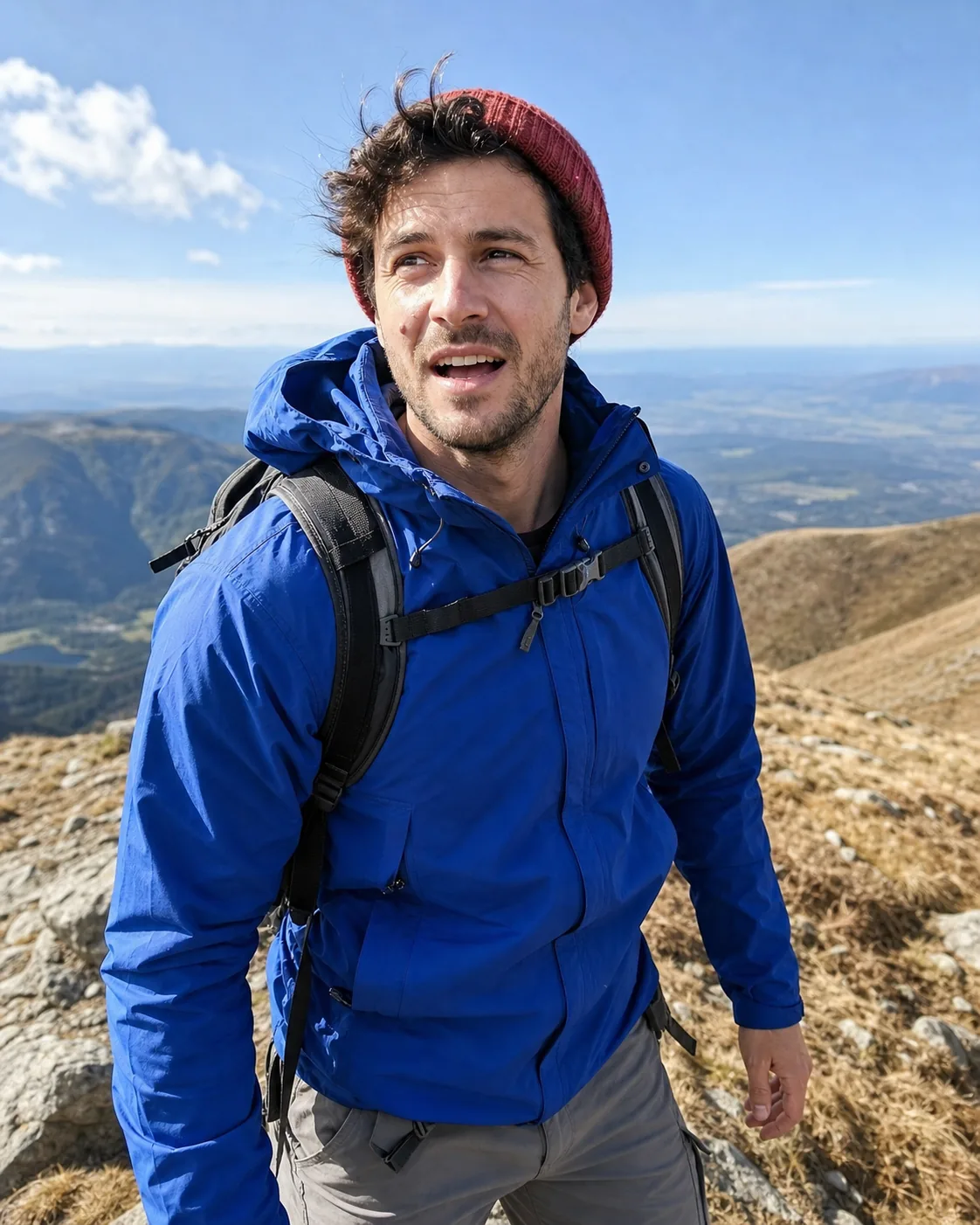 Alex catching his breath on a mountain trail